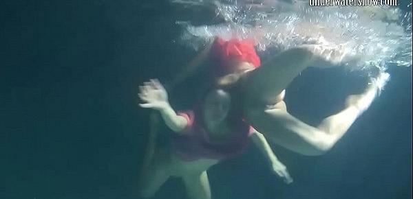  Two hot lesbians underwater touching each-other. Young girls schoolgirls are naked in the pool. Young nudists ..